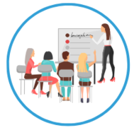 Gruppe sitzend und Dozentin steht an Schautafel